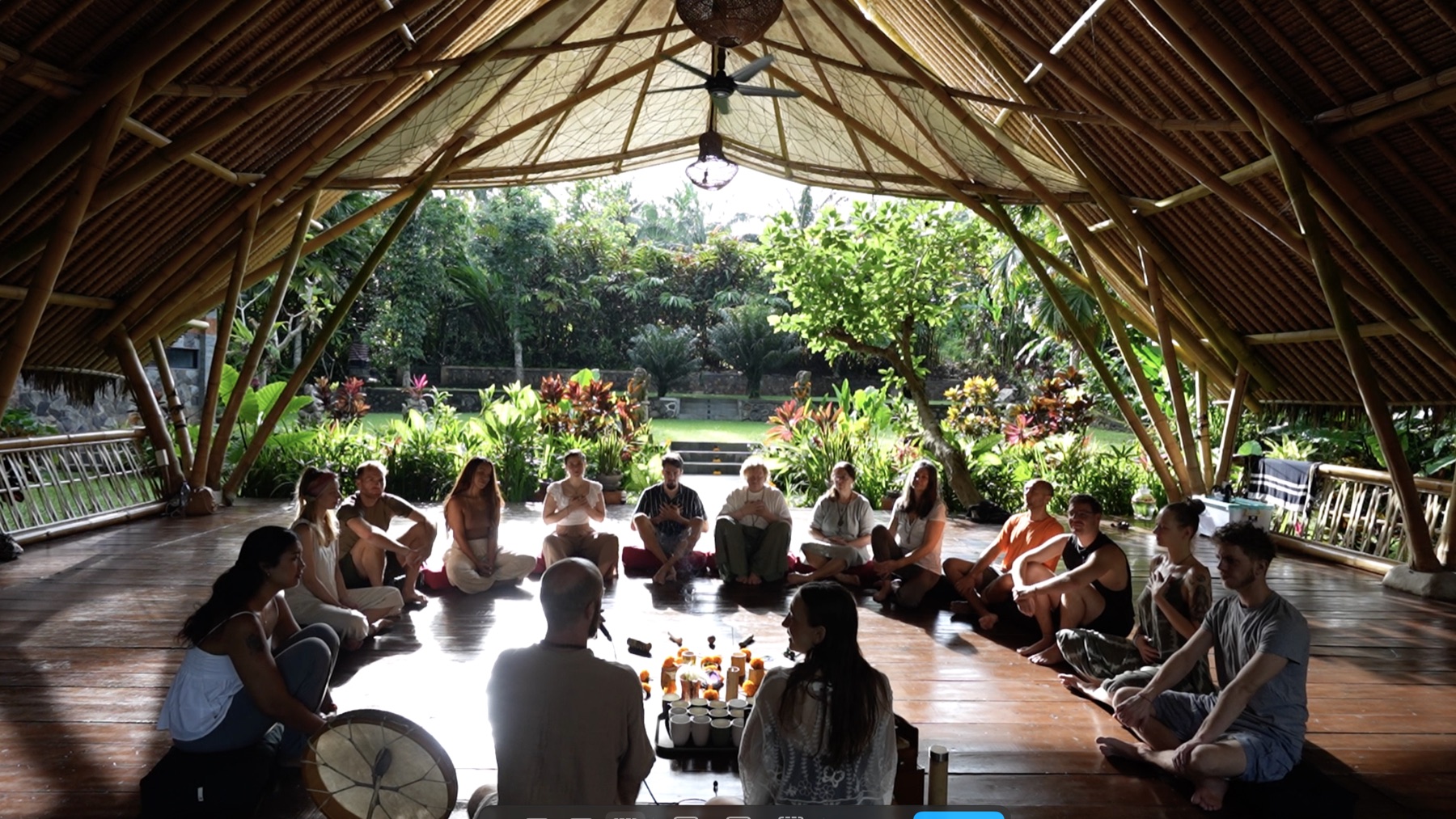 The community gathered in one large circle inside the bamboo shala