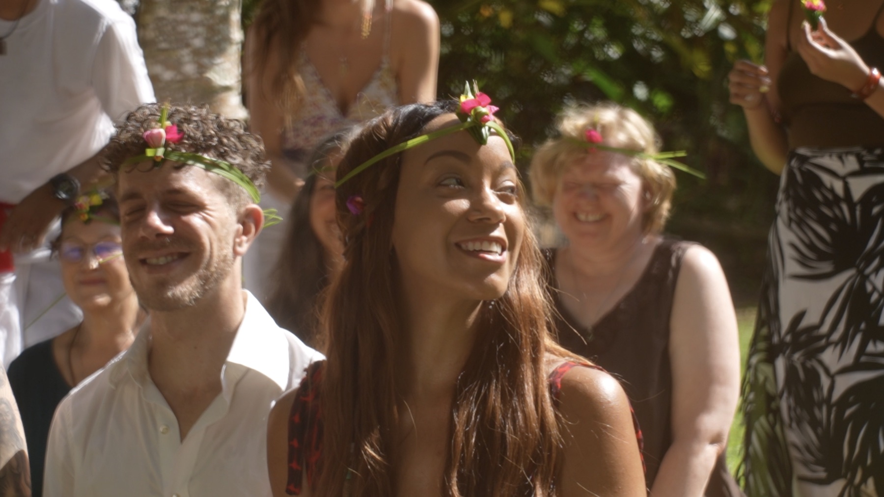 Participants laughing together outdoors in flower crowns